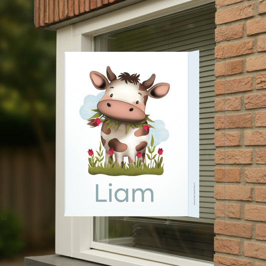 Geboortebord voor op het raam met naam en de afbeelding van een koe.