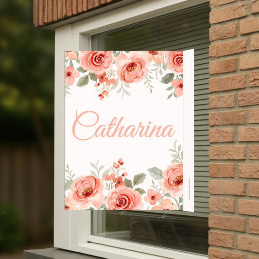 Geboortebord voor op het raam met naam en de afbeelding van een prachtige bloemen.